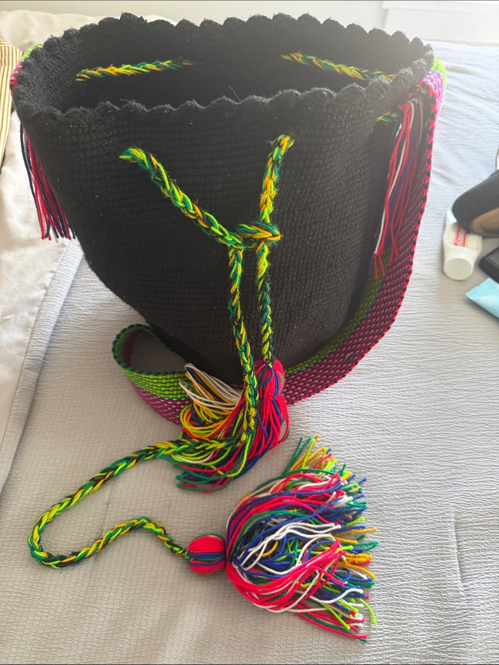 Handwoven Black Bucket Bag with Multicolor Strap and Tassel